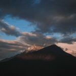 Mountain Landscapes - A stunning view of a mountain peak silhouetted a #12357274