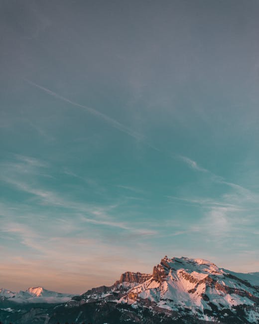 Mountain Landscapes - Stunning snow-capped mountain landscape under a #1850030