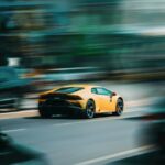 Luxury Cars - A vibrant yellow sports car captures attention a #8954274